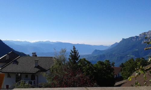 a house with a view of mountains in the distance at Garni Reider in Meltina