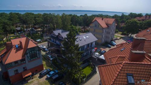 an overhead view of a town with houses and trees at la perla in Krynica Morska