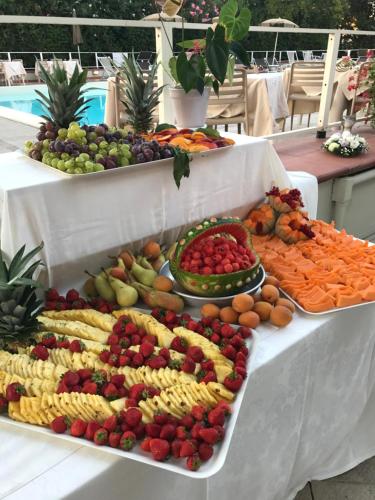 a display of fruits and vegetables on a table at PFA Hotel La Darsena - Follonica in Puntone di Scarlino