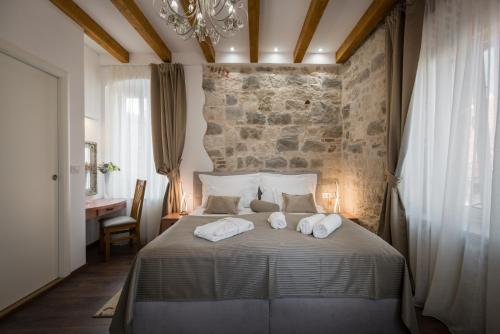 Posteľ alebo postele v izbe v ubytovaní ID Regal Residence