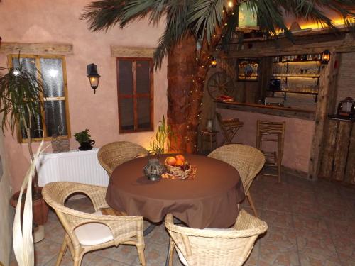 a dining room with a table with a bowl of fruit at Haus Oberkassel in Bonn