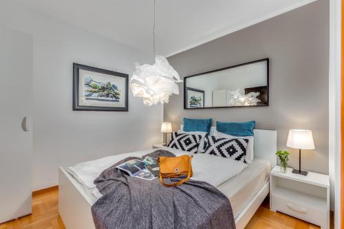 Posteľ alebo postele v izbe v ubytovaní Main Street apartments