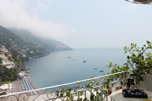 a view of a body of water with boats in it at Hotel Reginella in Positano
