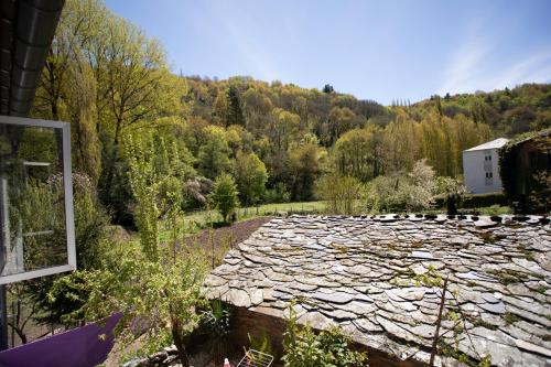 a large stone walkway in front of a forest at Pensión Santa Rosa in Samos