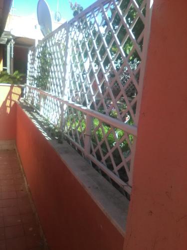a fence on the side of a building at casetta cassia roma in Isola Farnese