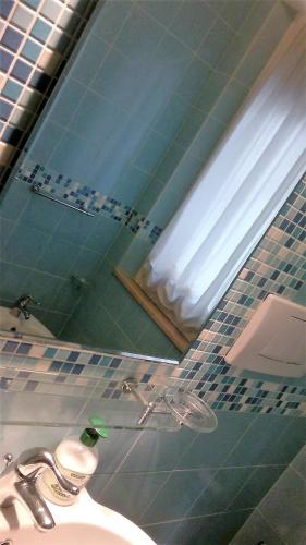 a bathroom with a sink and a mirror at B&B In Centro in San Benedetto del Tronto