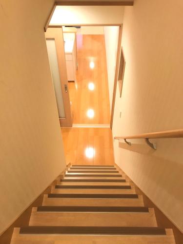 a staircase leading up to a building with a stair case at 一棟貸切り宿 GuestHouse 嵯峨嵐山 in Kyoto