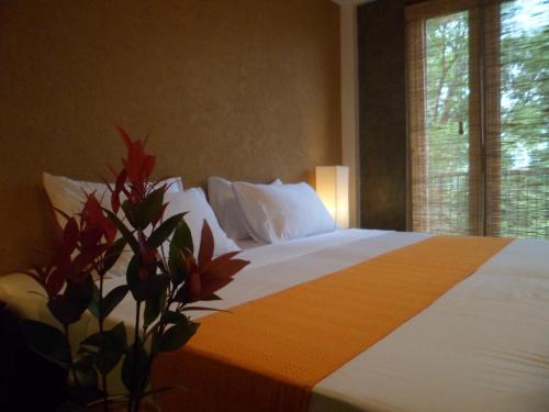Postel nebo postele na pokoji v ubytování Go Go Green Resort