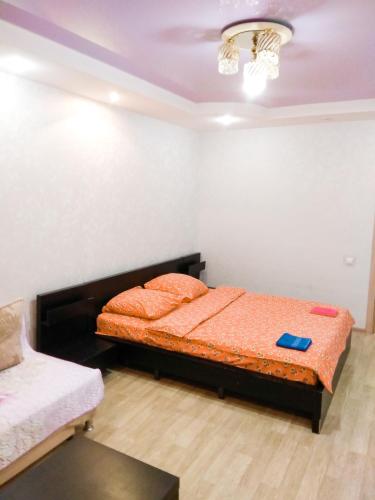 a bedroom with two beds in a room at Apartment Lukina 6 in Cheboksary