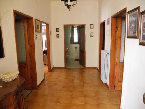 a hallway with wooden floors and doors in a house at Borgo Medioevale in Roccastrada