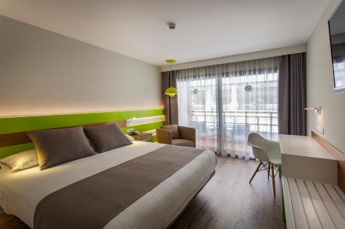 Ένα ή περισσότερα κρεβάτια σε δωμάτιο στο Vanilla Garden Boutique Hotel - Adults Only