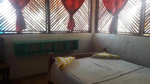 Postel nebo postele na pokoji v ubytování Eco-Hotel Playa Quilombo