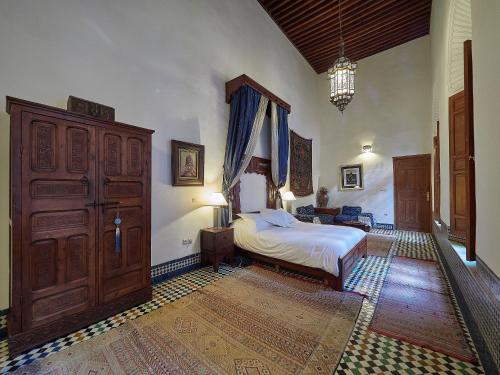 Ein Bett oder Betten in einem Zimmer der Unterkunft Dar Roumana