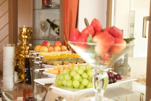 a buffet with a bunch of fruits and vegetables at Hotel Edelweiss in Maria Alm am Steinernen Meer