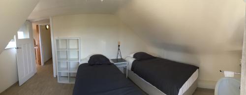 Ένα ή περισσότερα κρεβάτια σε δωμάτιο στο Maison du golf