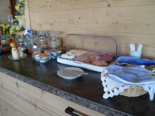 a counter top with a tray of food on it at Berggasthaus Kraxenberger in Brannenburg