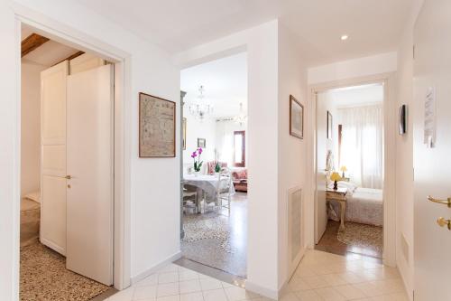 a hallway with a door leading to a living room at Prince Apartments in Venice