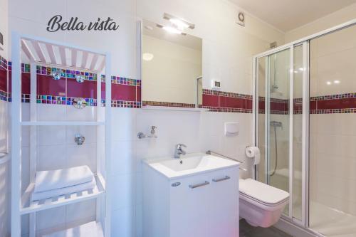 a bathroom with a sink and a shower and a toilet at Luxury Apartments Tramontana in Medulin