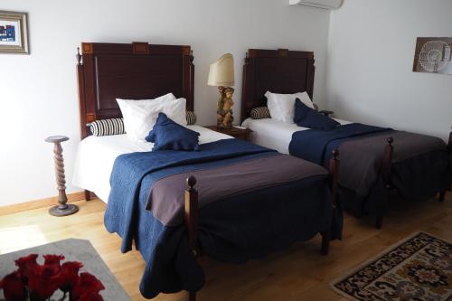 Een bed of bedden in een kamer bij Casa do Massorim
