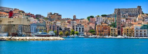 a view of a city with a large body of water at Hotel Panoramico in Scauri