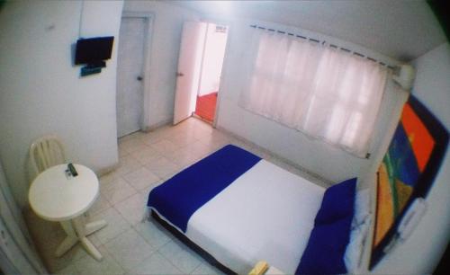 Postel nebo postele na pokoji v ubytování QuillaHost Guesthouse