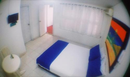 Postel nebo postele na pokoji v ubytování QuillaHost Guesthouse