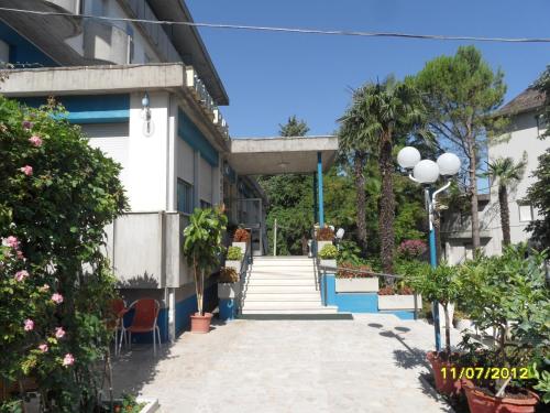a walkway in front of a building at Hotel Prati in Castrocaro Terme