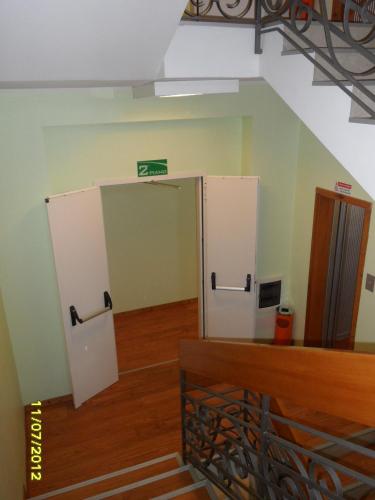 an empty room with a door in a building at Hotel Prati in Castrocaro Terme