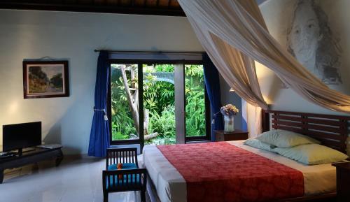 Ein Bett oder Betten in einem Zimmer der Unterkunft Villa Shantitara Bungalows