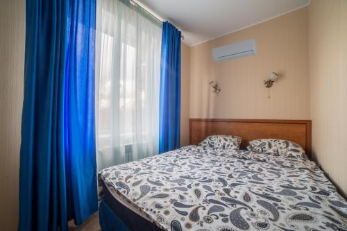 Кровать или кровати в номере Отель Теремок Московский 