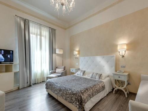 Un pat sau paturi într-o cameră la Hotel Palagi