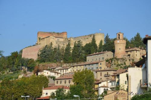 a town with castles on top of a hill at Hotel Prati in Castrocaro Terme