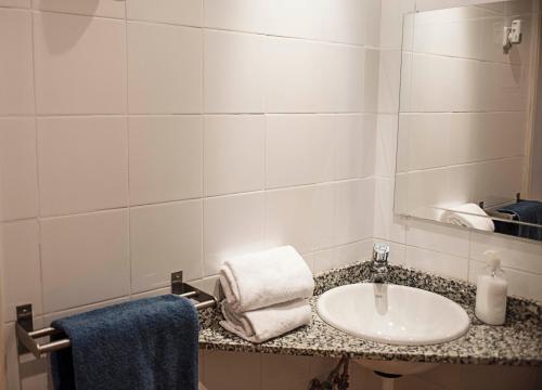 a bathroom with a sink and a mirror at Fashion House in Barcelona