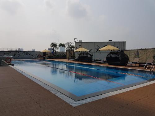 a large swimming pool on top of a building at Lotte The Residence in Hanoi