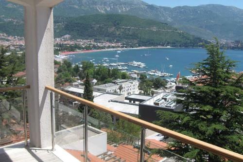 a view of a harbor from a balcony of a house at Apartmani Katarina in Budva