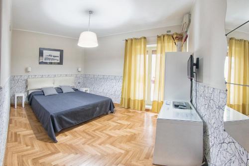 En eller flere senge i et værelse på B&B Cappella Vecchia 11