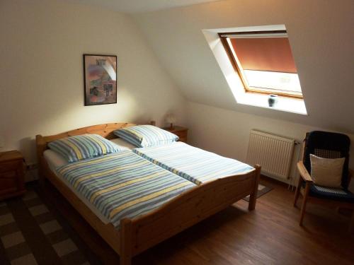 En eller flere senge i et værelse på Ferienpension Lindenhof