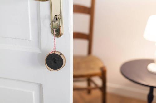 a door with a door knob and a chair at De Oude Pastorie Macharen in Macharen