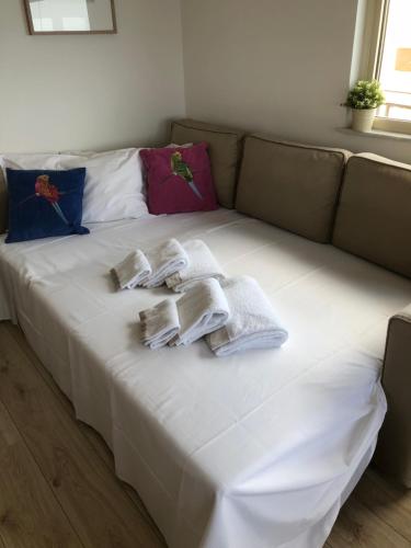 a bed with towels on top of it at Casa Vitale in Aci Castello