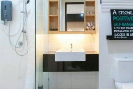 a bathroom with a sink and a toilet at Miko's Modern Studio @ Setia Alam in Shah Alam