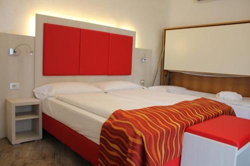 Postel nebo postele na pokoji v ubytování Hotel Da Tino