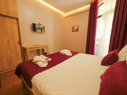 Postel nebo postele na pokoji v ubytování La'Rooms
