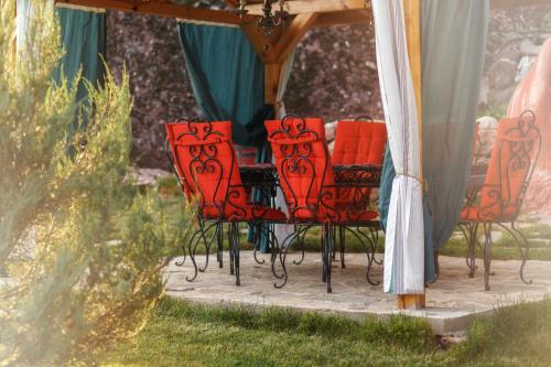 a group of chairs sitting under a gazebo at Villa Kada in Belogradchik