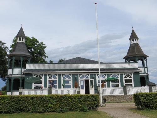 a blue and white building with two towers at Nysted Strand Camping & Cottages in Nysted