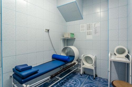 a hospital room with a bed and two toilets at Hotel *** NAT Kołobrzeg in Kołobrzeg
