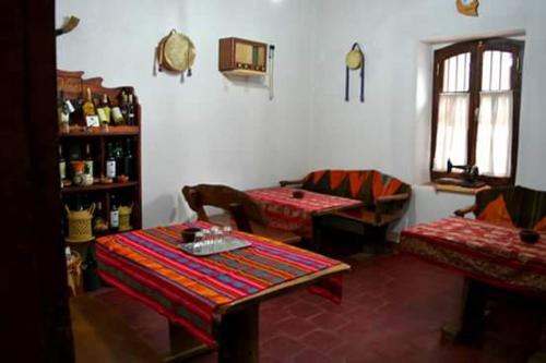 a living room with a table and two chairs at Las Tinajas de San Carlos in San Carlos