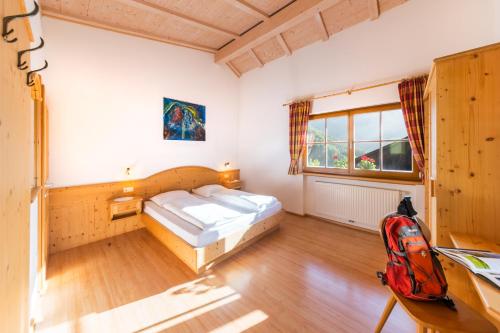 Ένα ή περισσότερα κρεβάτια σε δωμάτιο στο Pardellerhof Lüsen