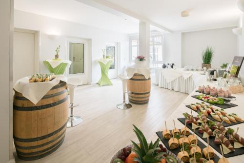 a buffet of food in a room with tables of food at Best Western Wein- und Parkhotel in Nierstein