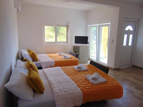 Postel nebo postele na pokoji v ubytování Apartments Bibic