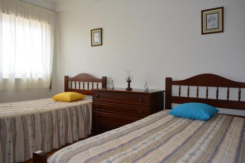 Una cama o camas en una habitación de Casa da Praia de Peniche
